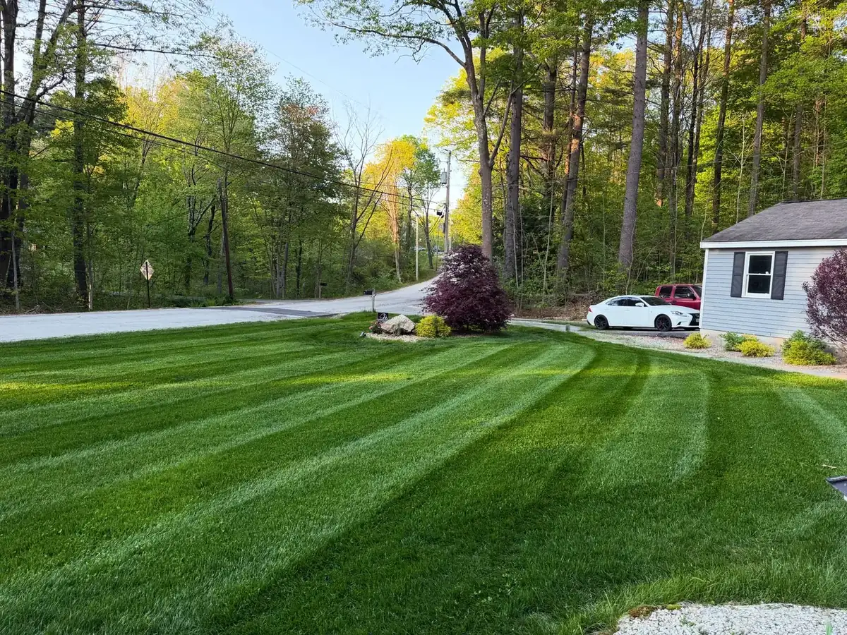 Freshly striped front lawn in spring on a Southern New Hampshire property